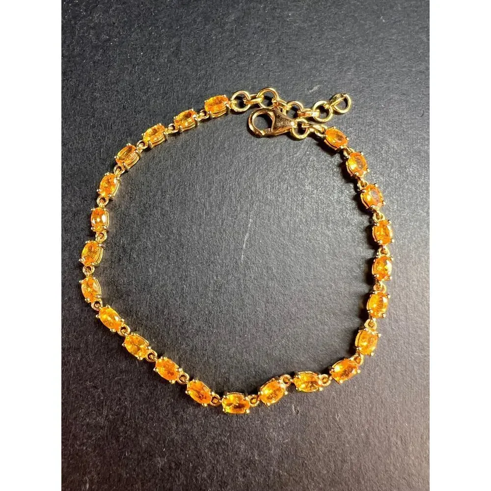 Yellow spessartine garnet tennis bracelet in gold over sterling silver